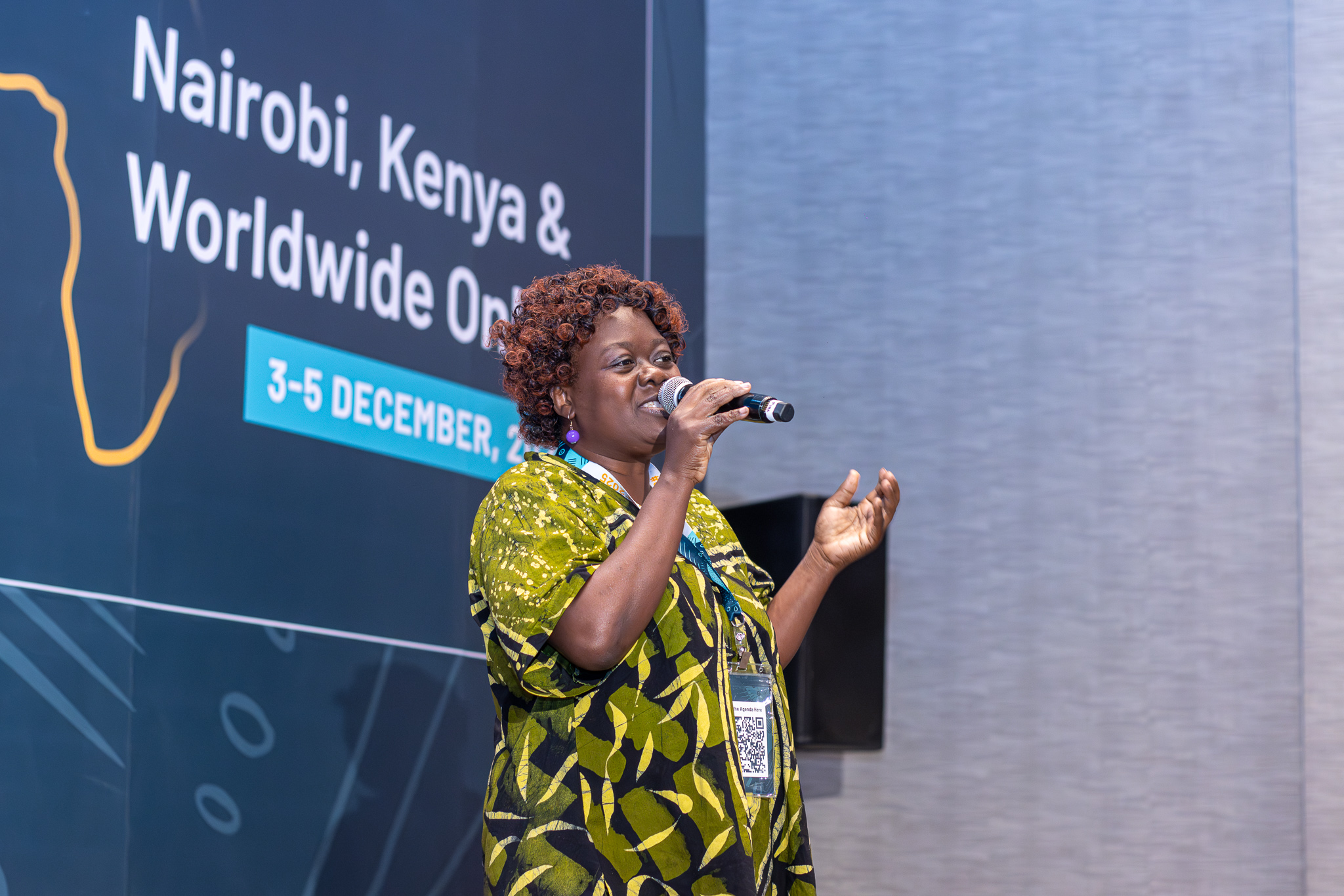 A Digital Champion presenting on stage at a global health conference