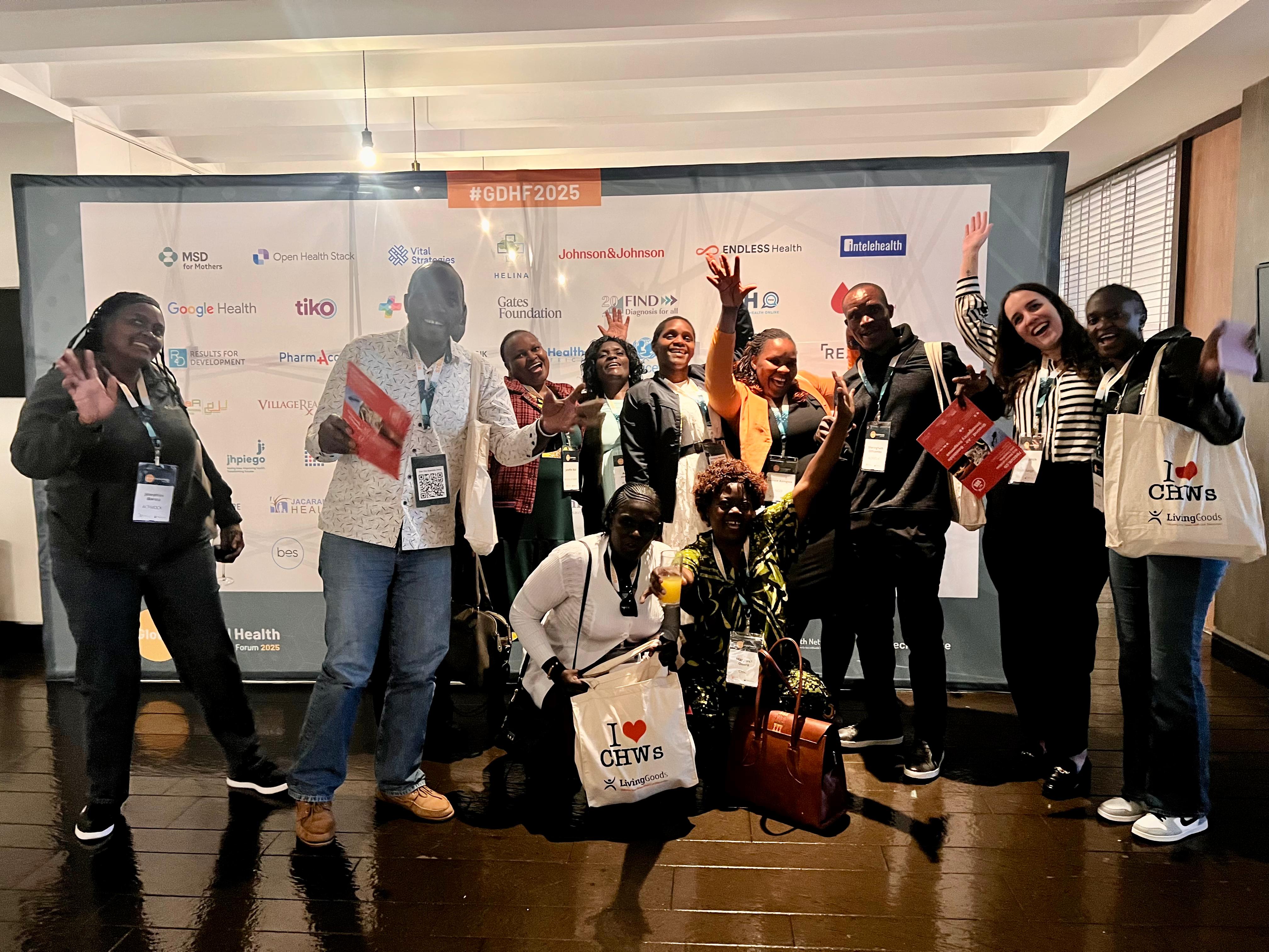 A joyful group of Digital Bridge partners and community health workers at a global health conference